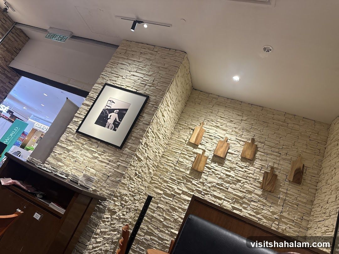 Restaurant Interior with Stone Wall and Artwork