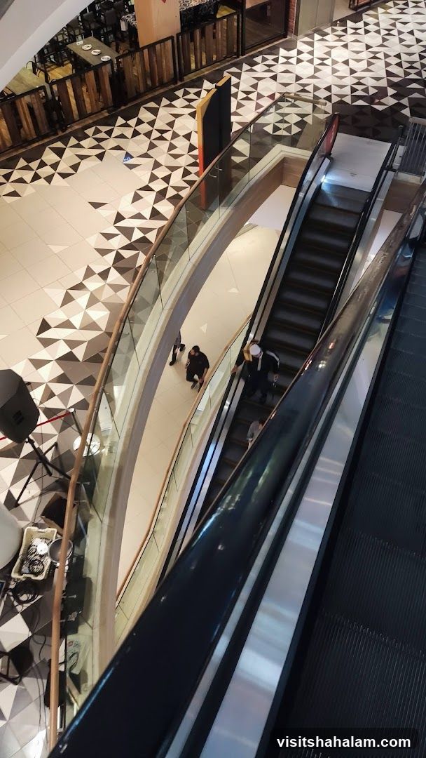 Mall Interior with Escalators and Geometric Flooring