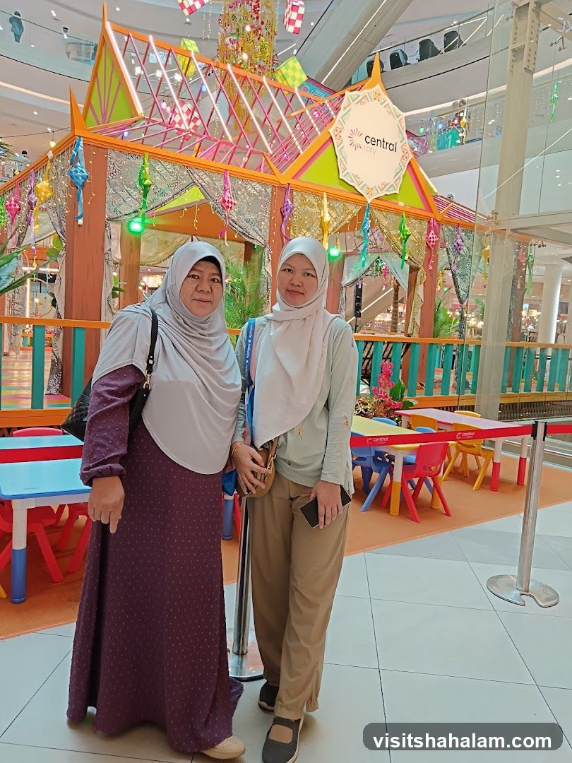 Two Women Posing in Front of a Festive Display
