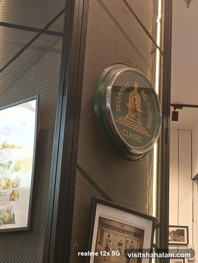 Coffee shop interior with clock and artwork