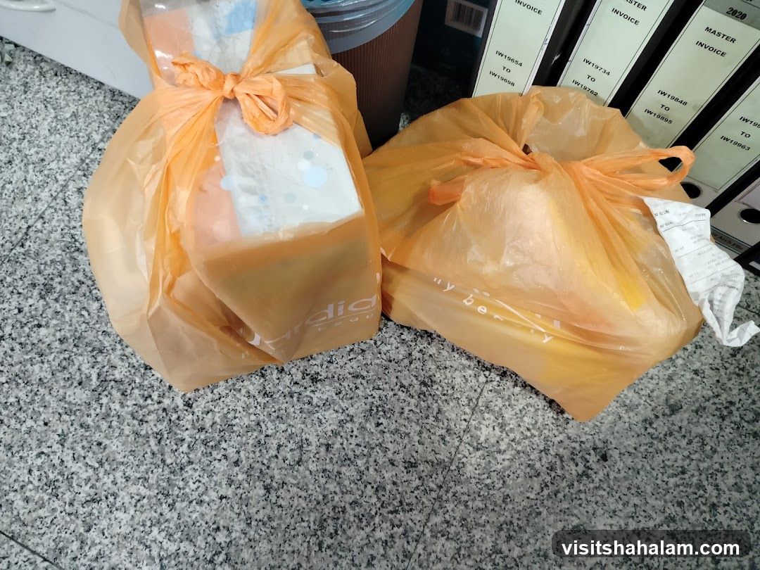 Two Orange Plastic Bags on a Counter