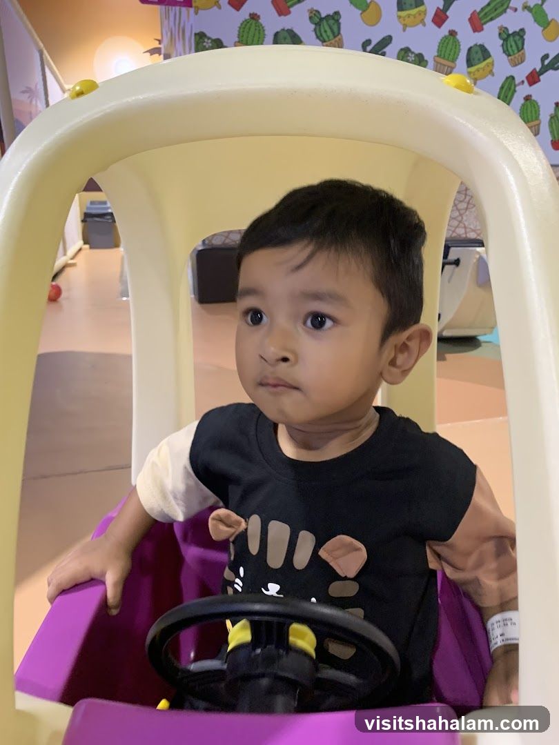 Child in a Toy Car