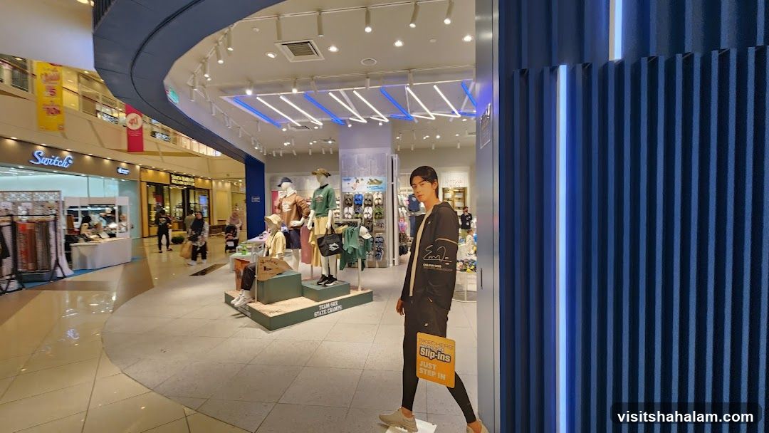 Store Interior with Mannequins and Cardboard Cutout