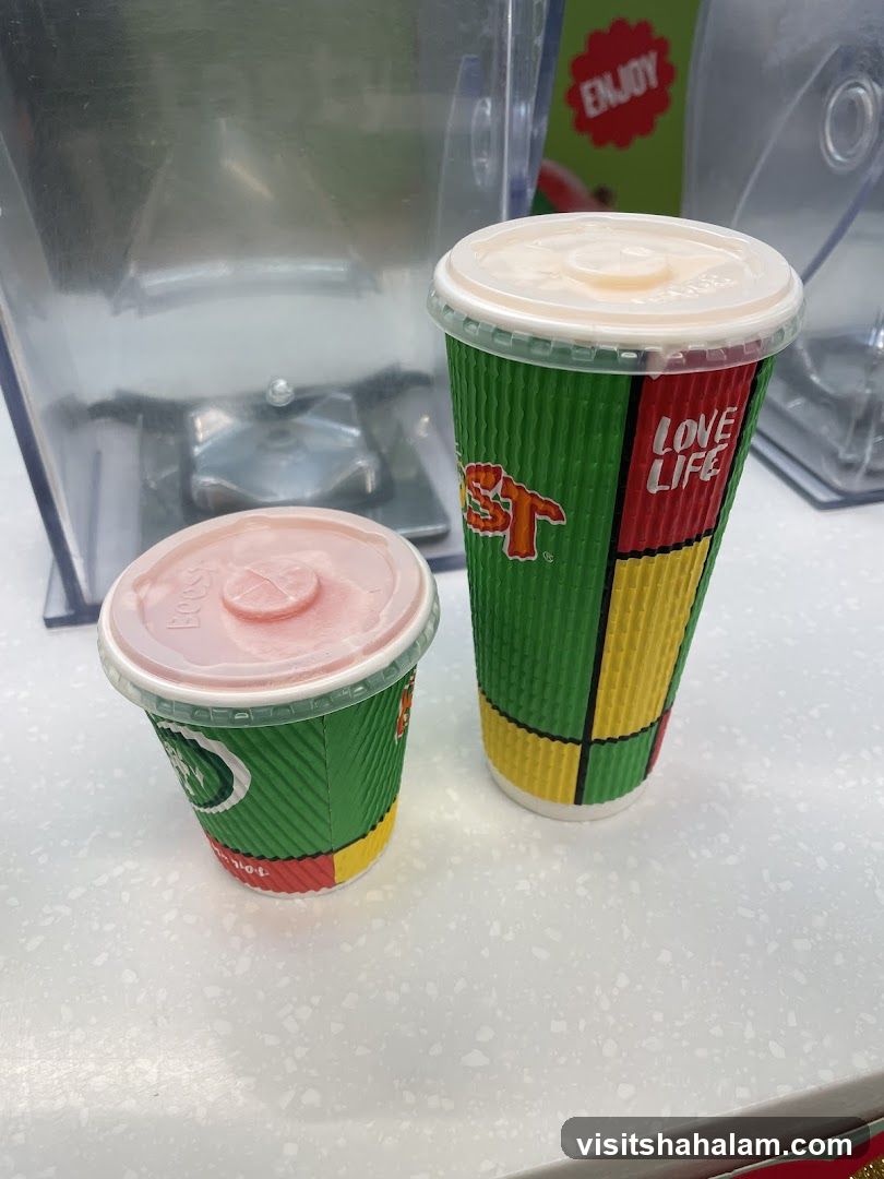 Two drinks with a blender in the background