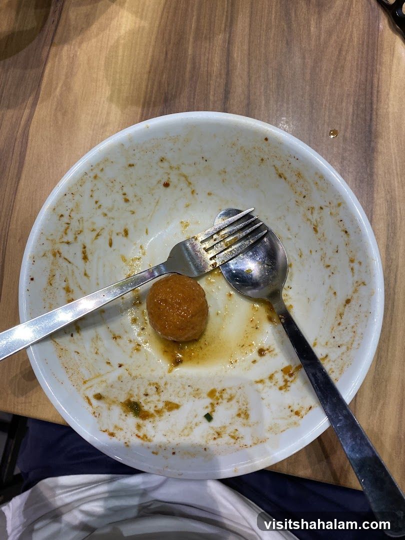 Dirty Bowl with Meatball and Utensils