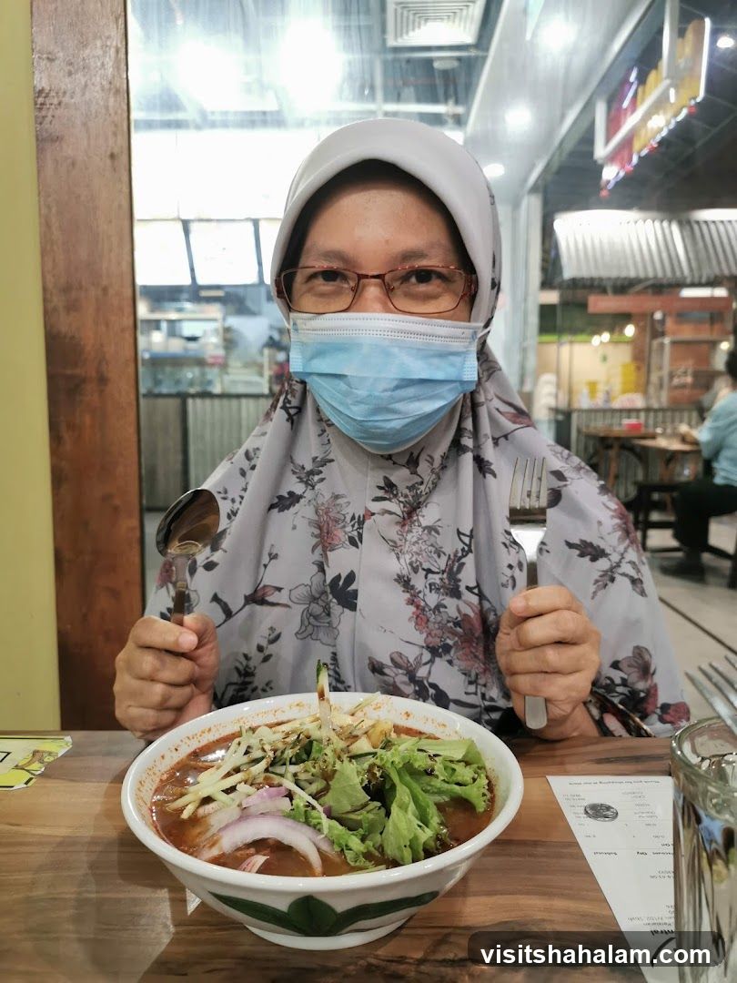 Woman with Mask Eating Noodles