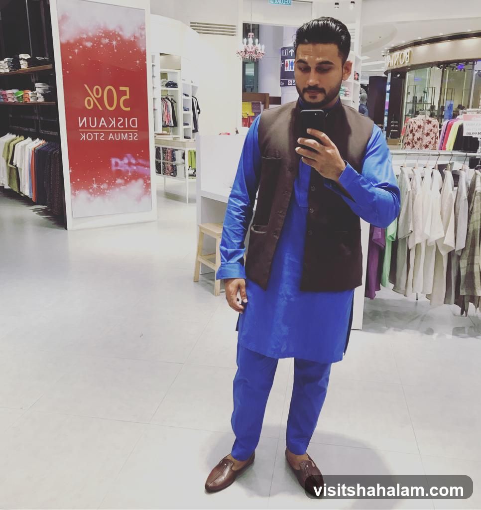 Man taking a selfie in a clothing store
