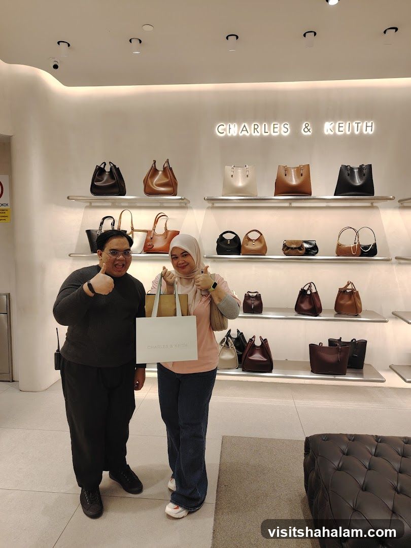 Two people posing in a Charles & Keith store