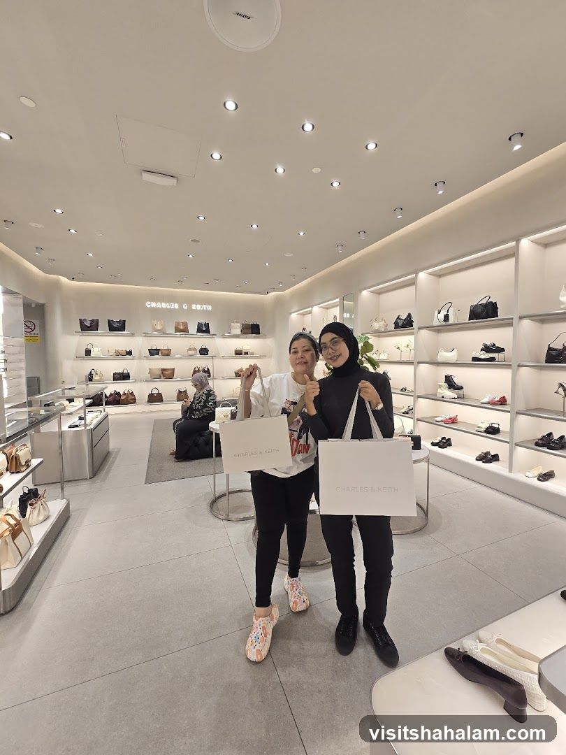 Two women holding shopping bags in a store