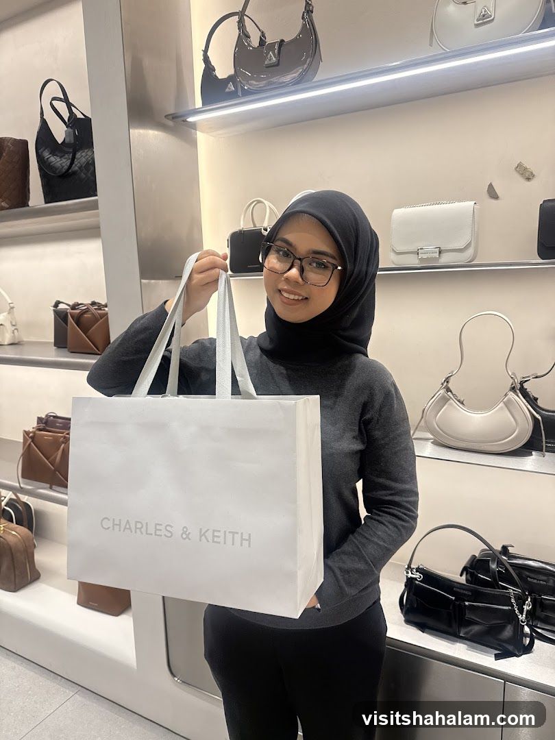 Woman Holding a Charles & Keith Shopping Bag