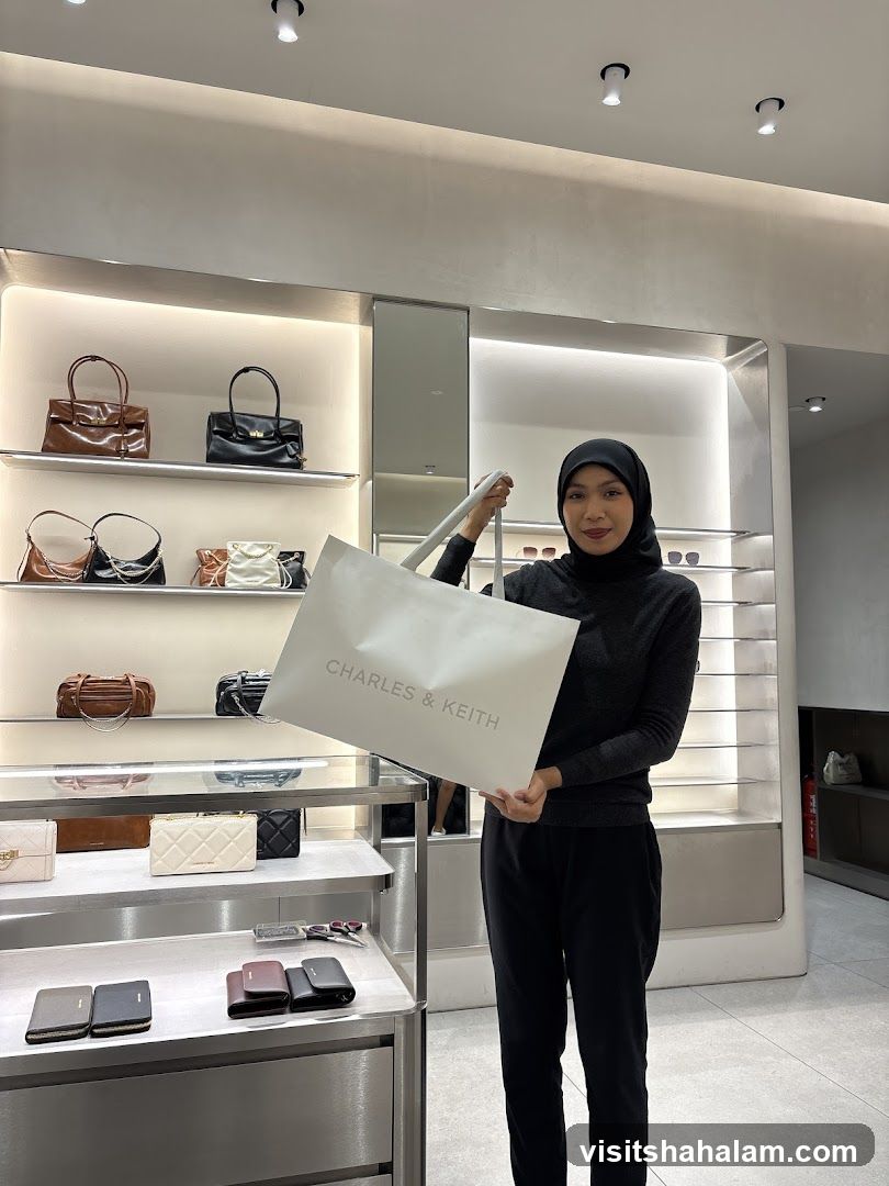 Woman Holding a Charles & Keith Shopping Bag