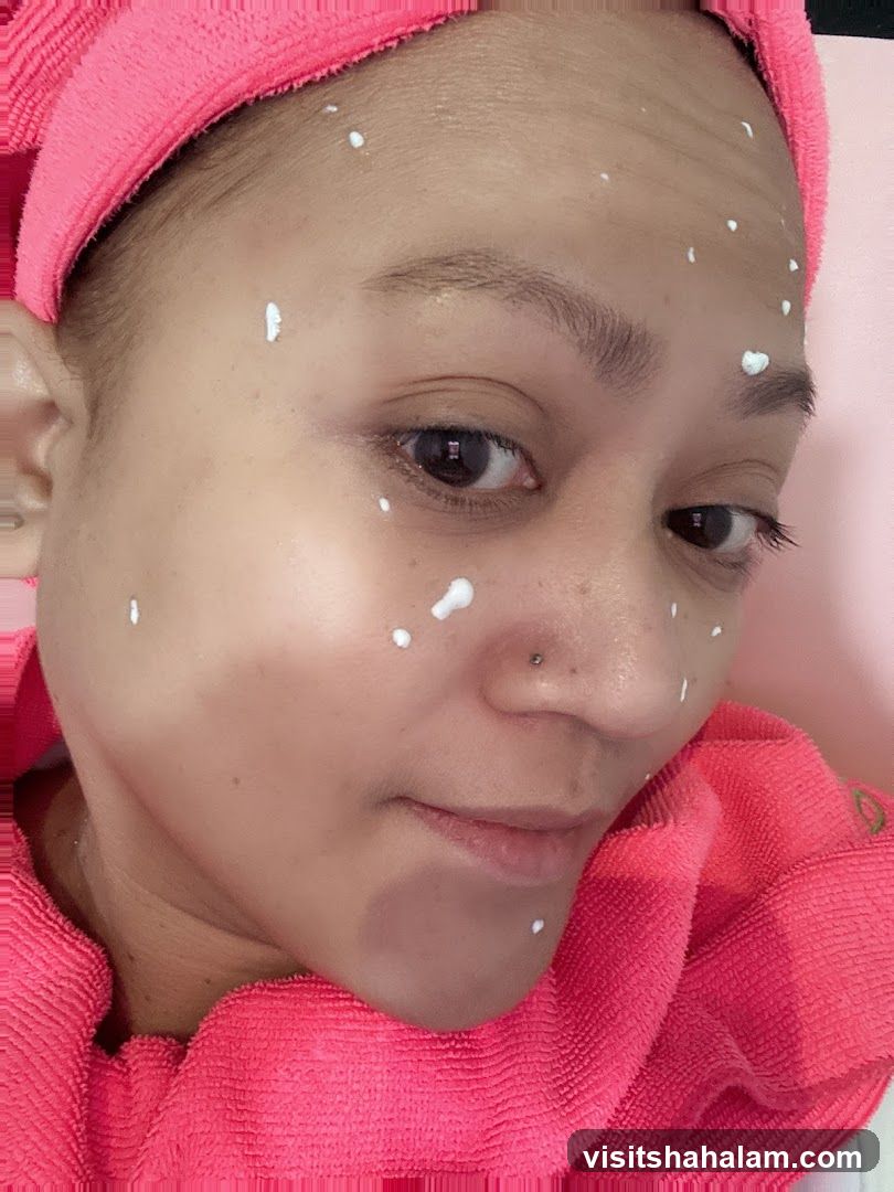 Woman with cream dots on face