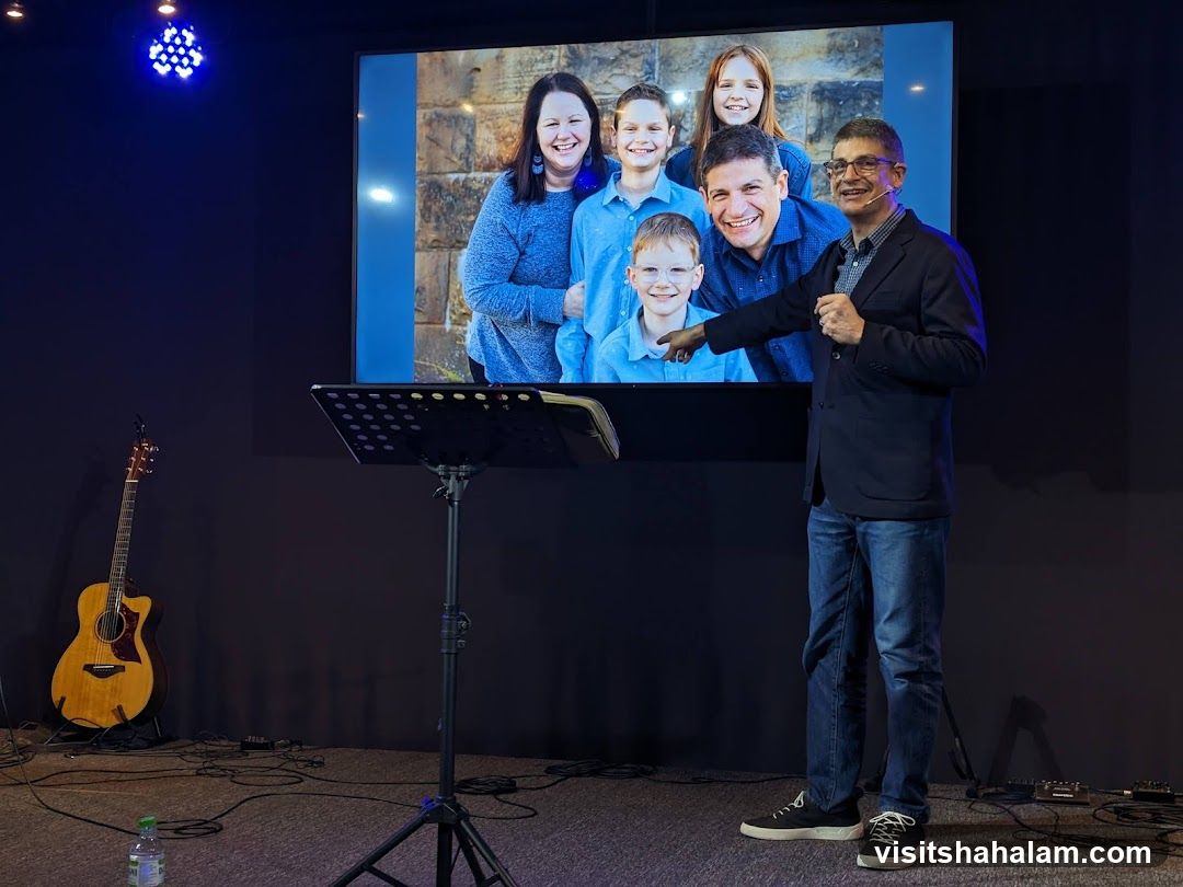 Man presenting a family photo