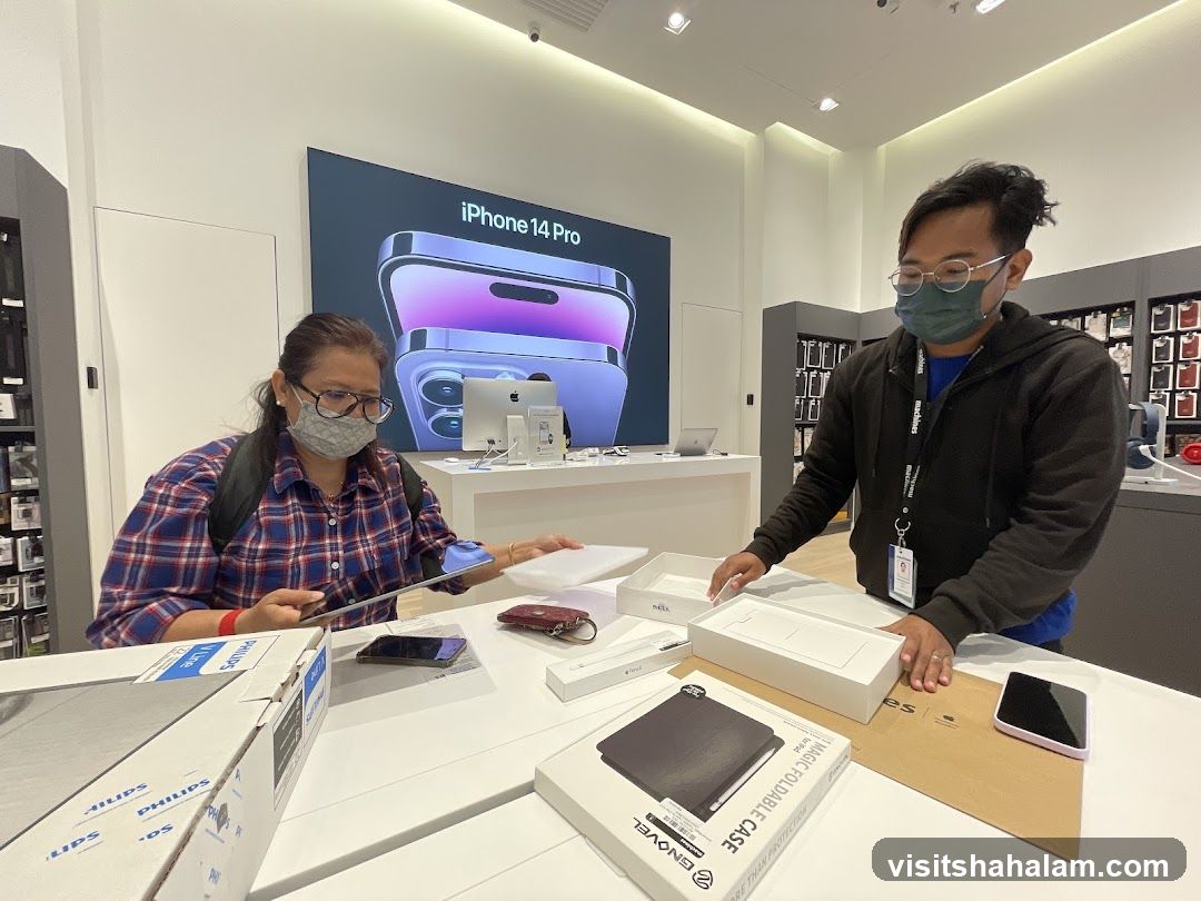 Customers examining products in an electronics store
