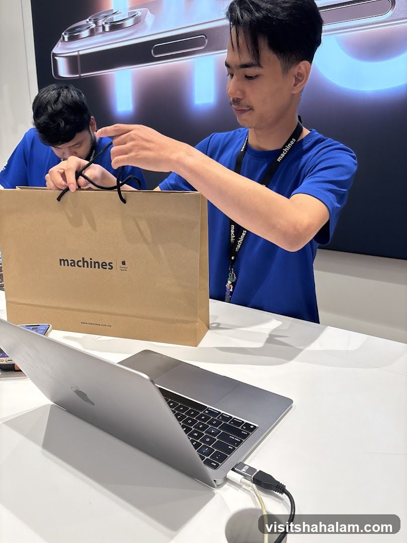 Sales associates with shopping bag and laptop