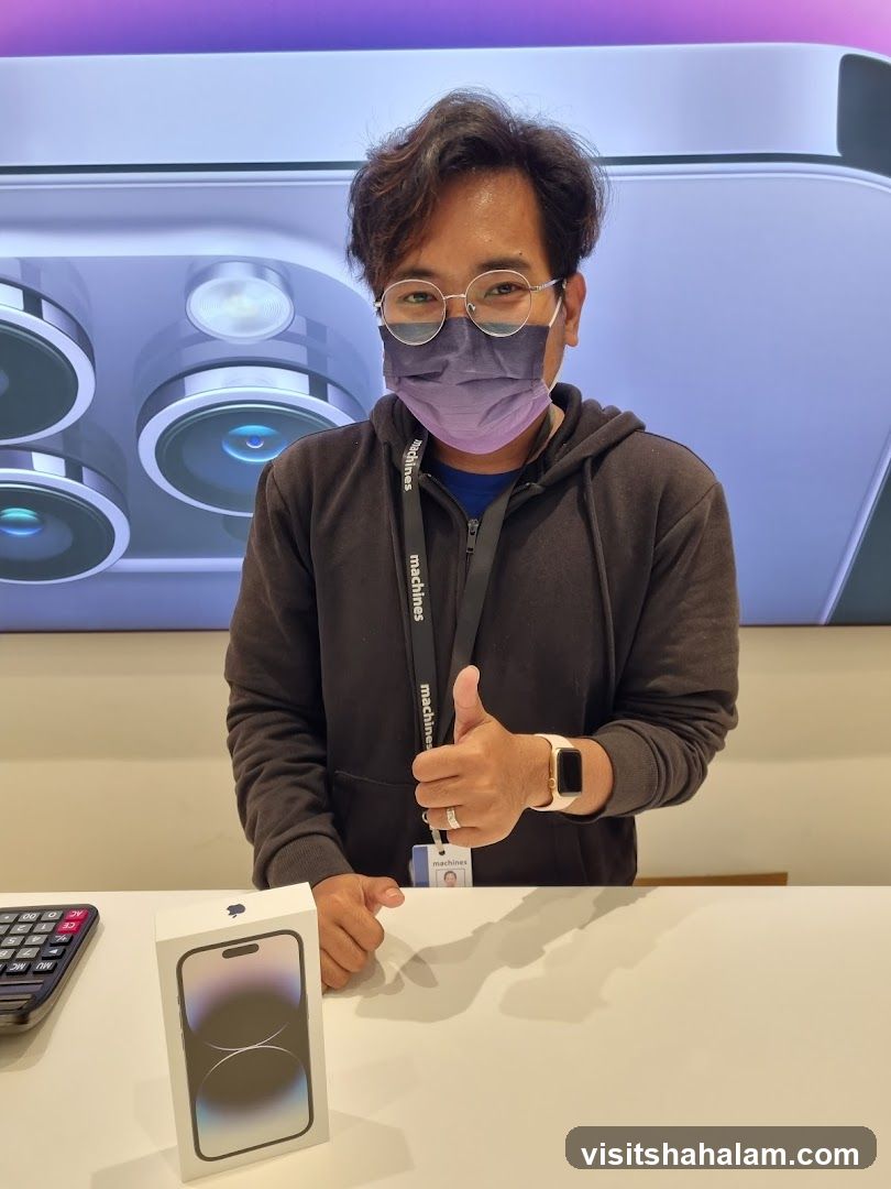 Man with iPhone box