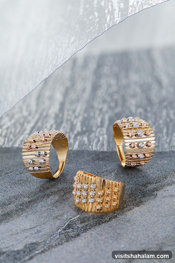 Three gold rings with beaded details
