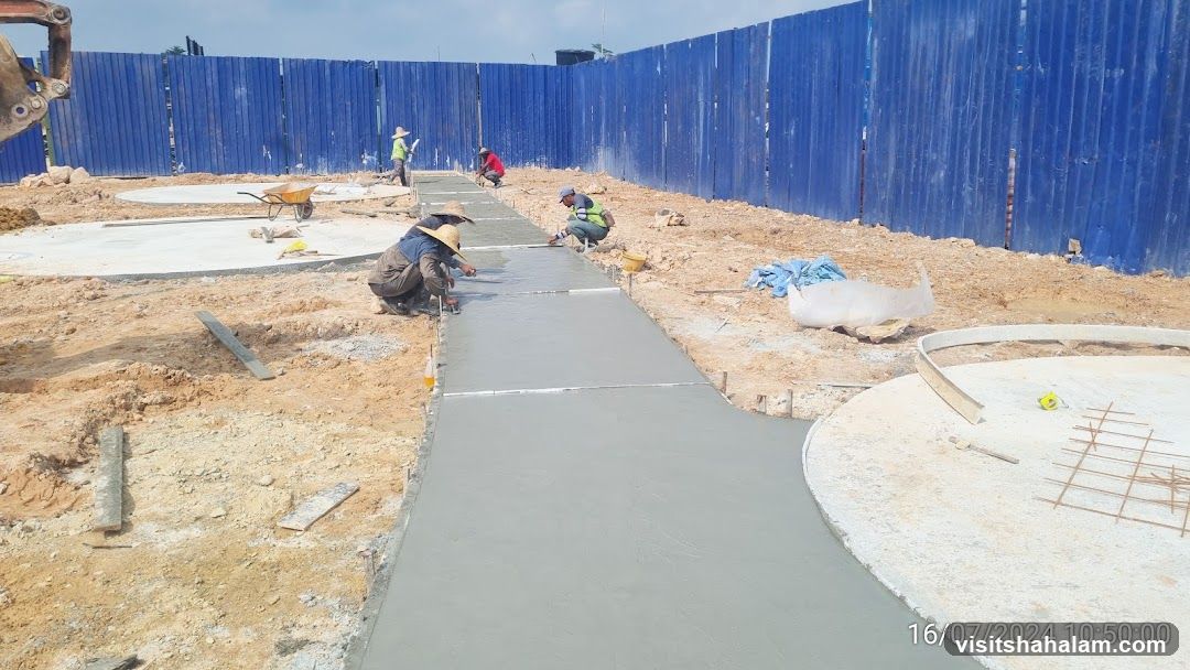 Construction workers pouring concrete