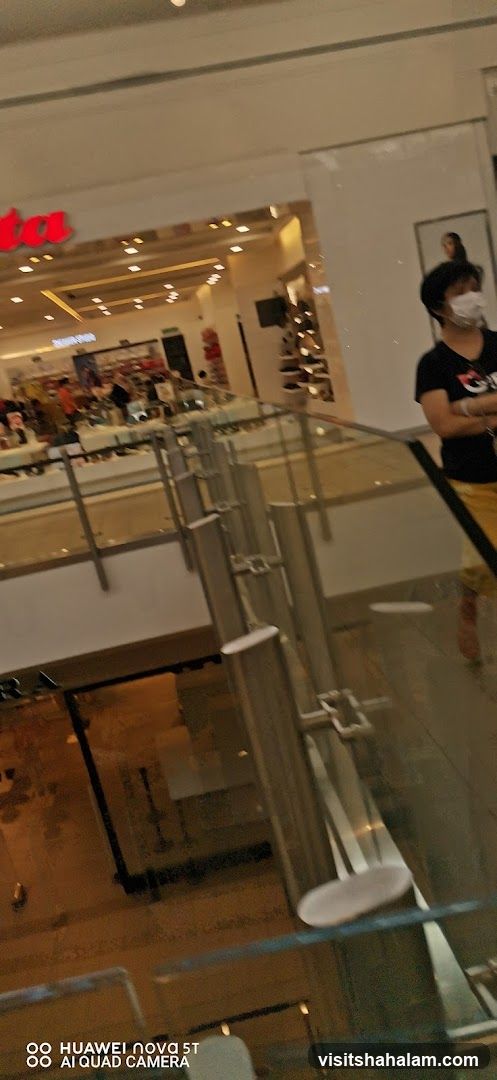 Interior of a shopping mall with a store visible