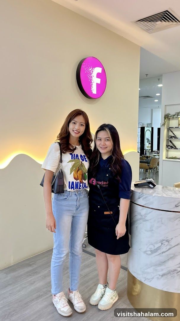 Two women posing in a salon