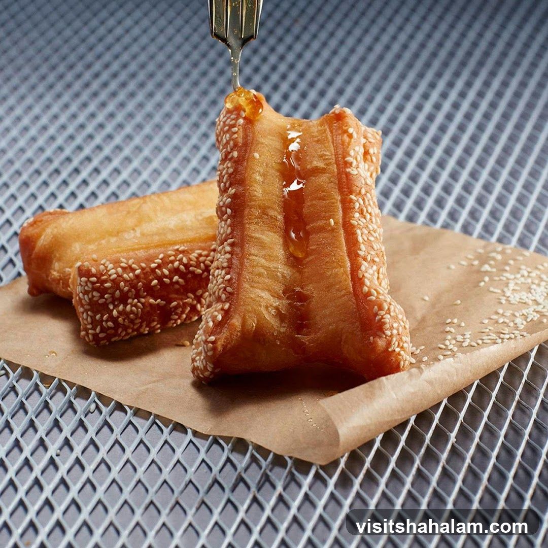Fried Dough Sticks with Sesame Seeds and Honey