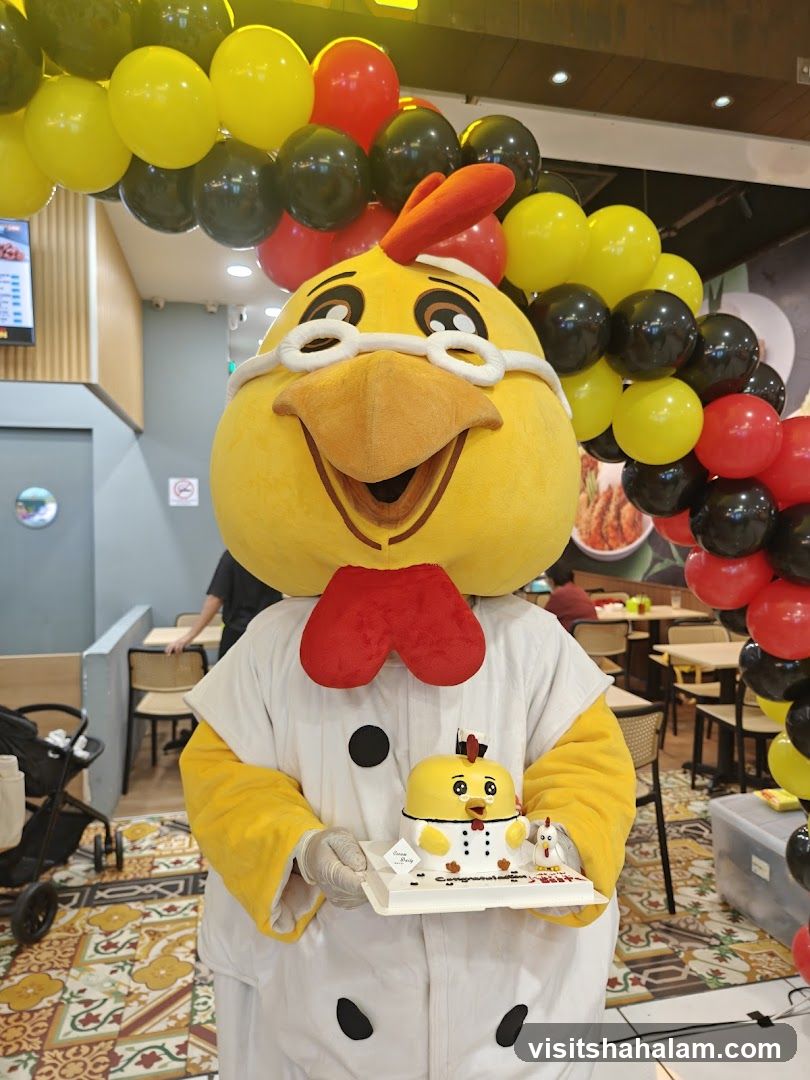 Mascot holding a cake