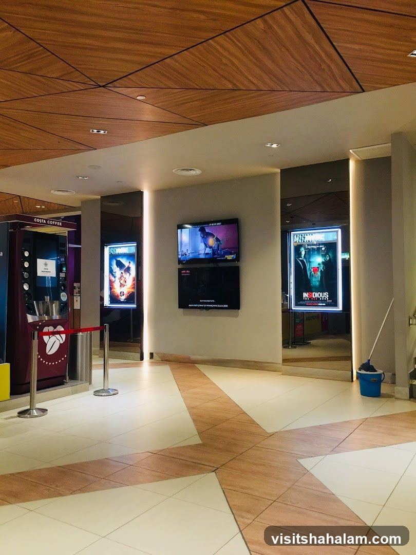 Cinema Lobby with Movie Posters and Coffee Machine