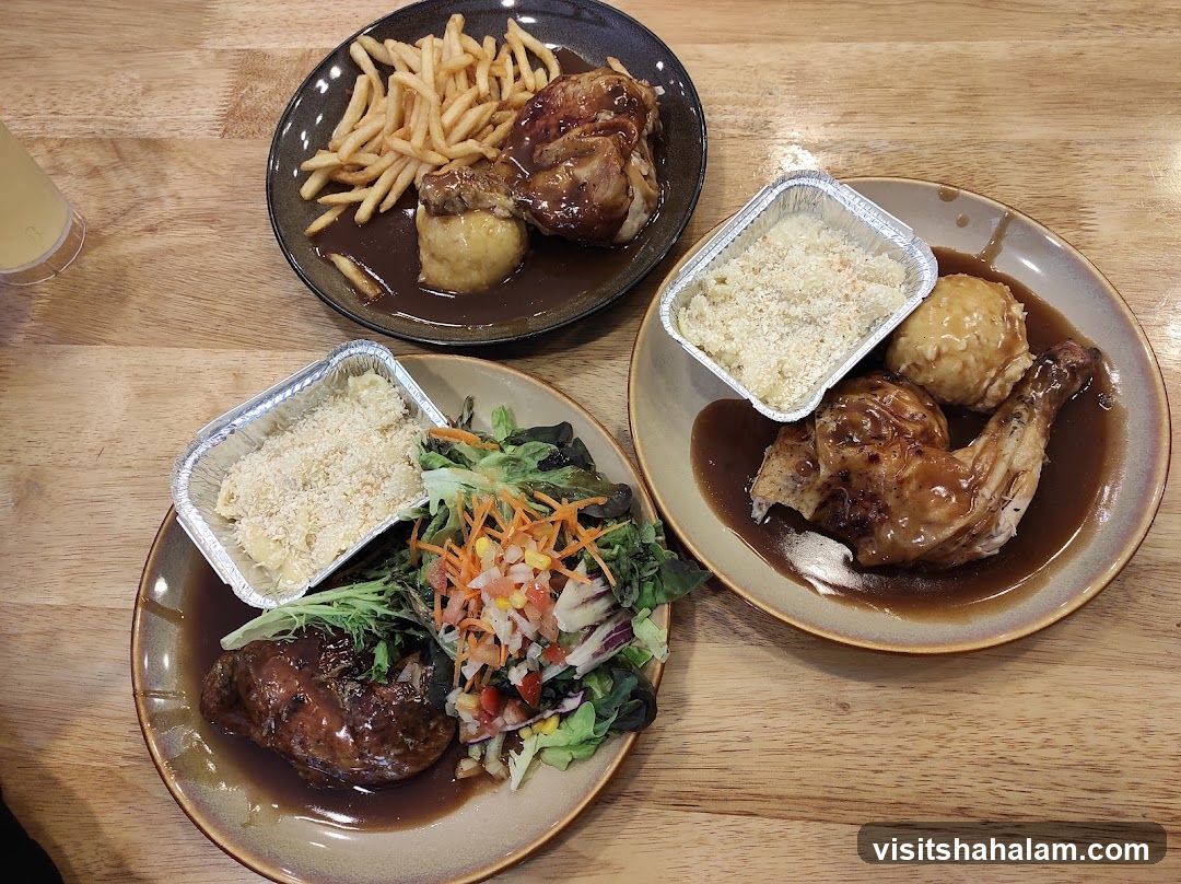 Three plates of roasted chicken with sides