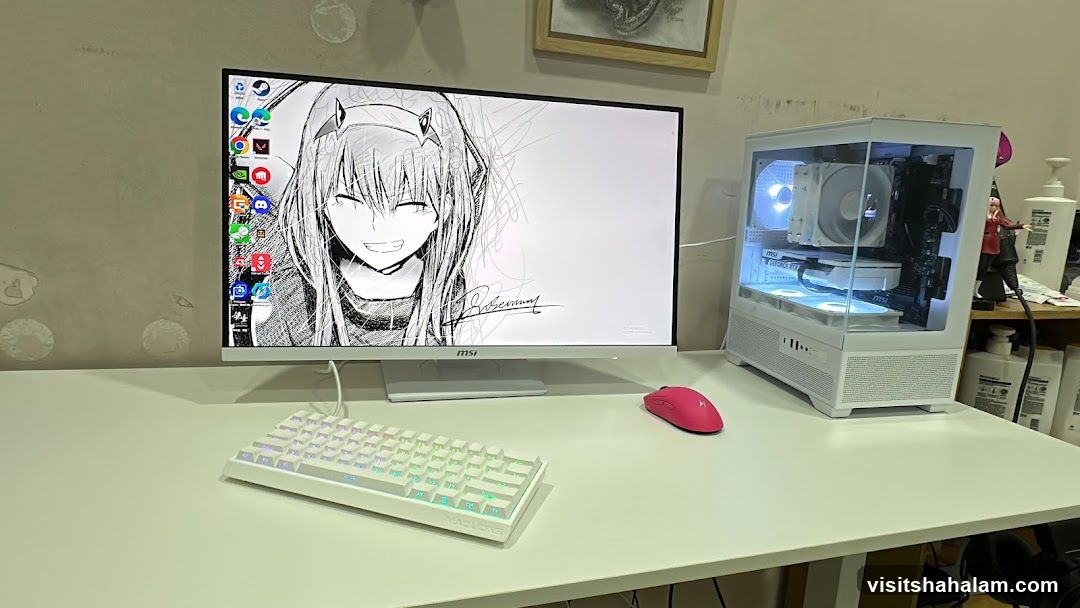 White computer setup with anime wallpaper