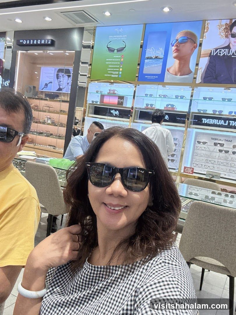 People trying on sunglasses in a store