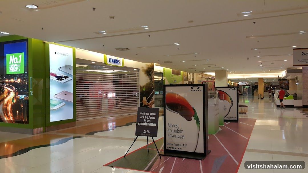 Mall Interior with Storefronts and Advertisements