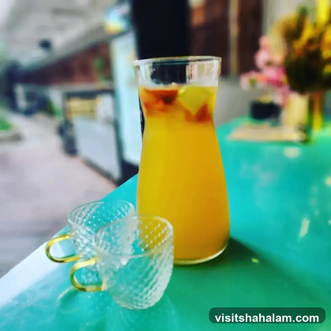 Pitcher of Orange Drink with Two Glasses