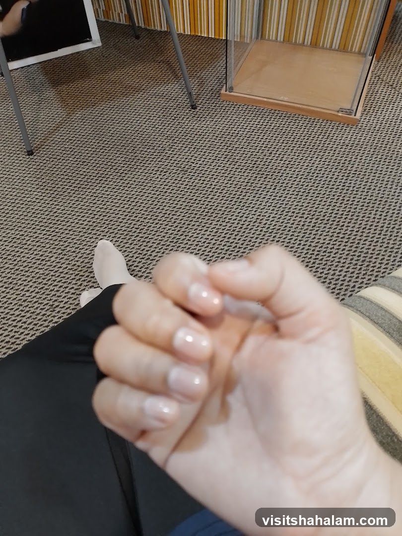 Close-up of a person's hands with manicured nails