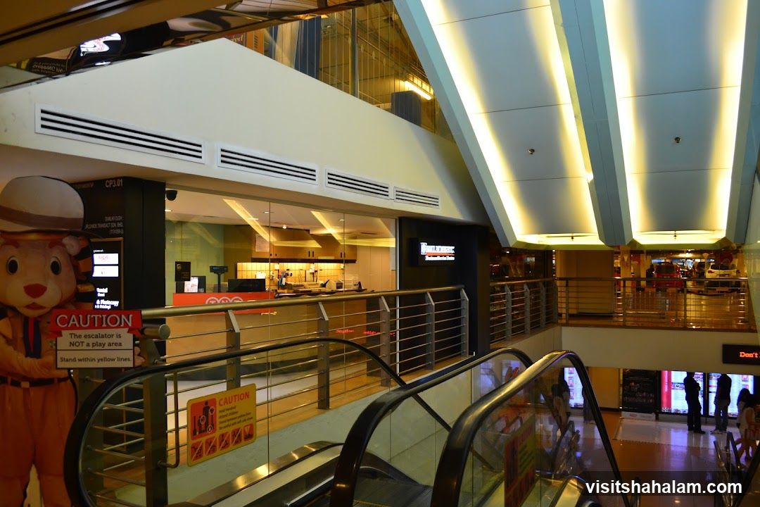 Mall Interior with Escalators and Food Stalls