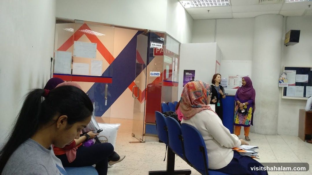 People waiting in a post office