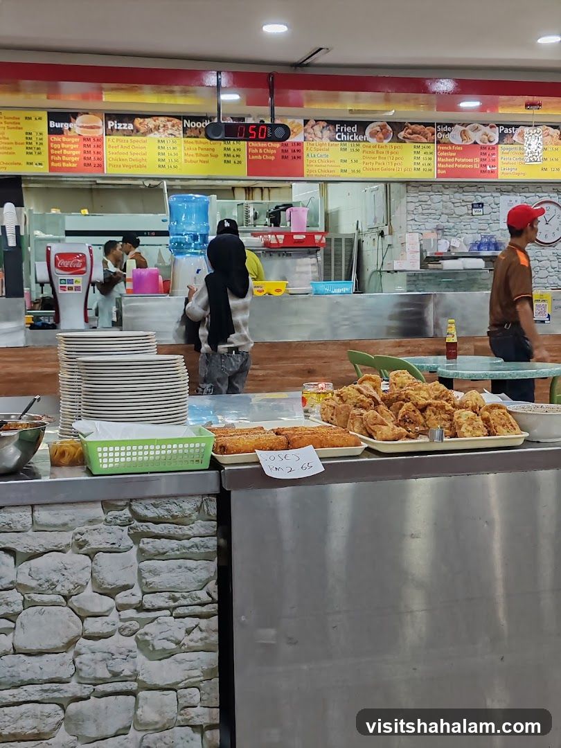 Food court counter with menu and fried food