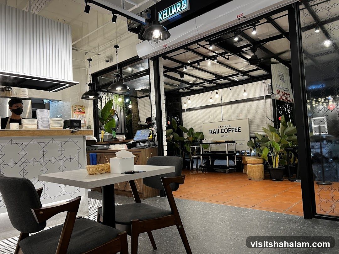 Interior of a cafe with seating and kitchen area