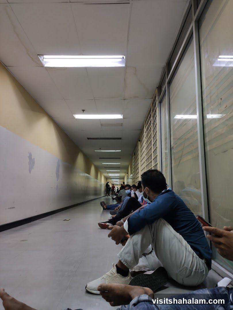 People waiting in a hallway
