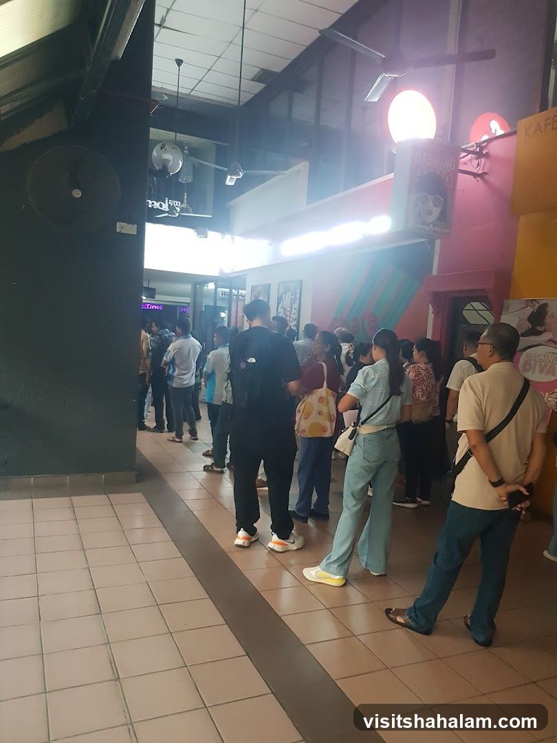 People queuing in a brightly lit indoor walkway