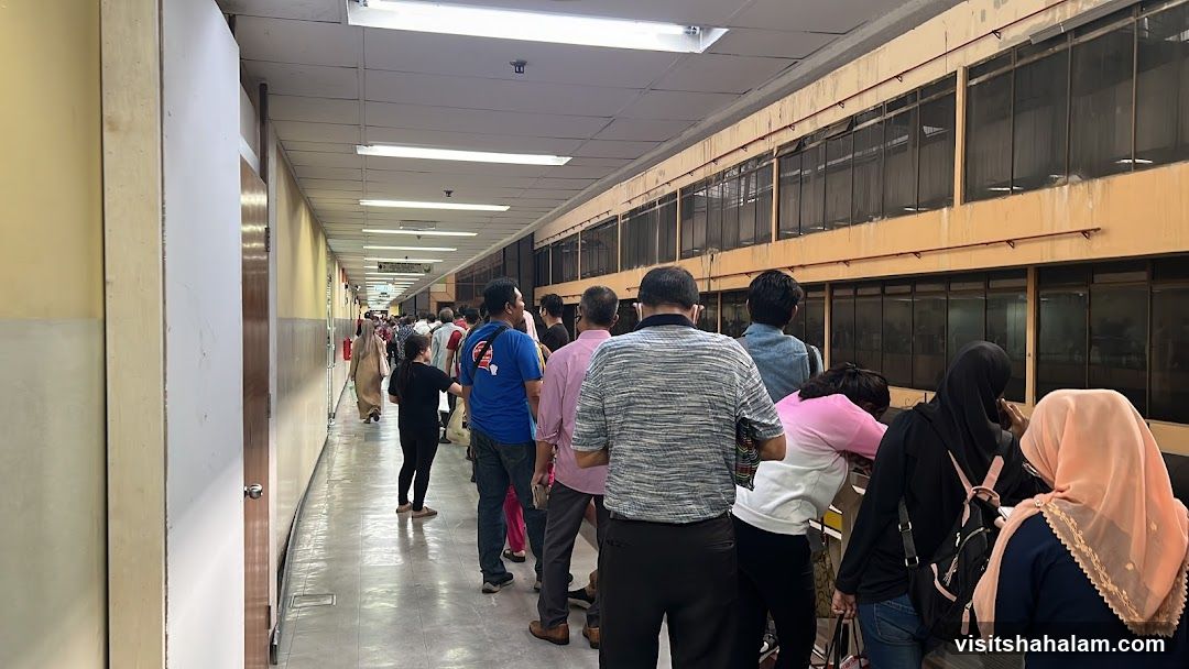 People in a long hallway