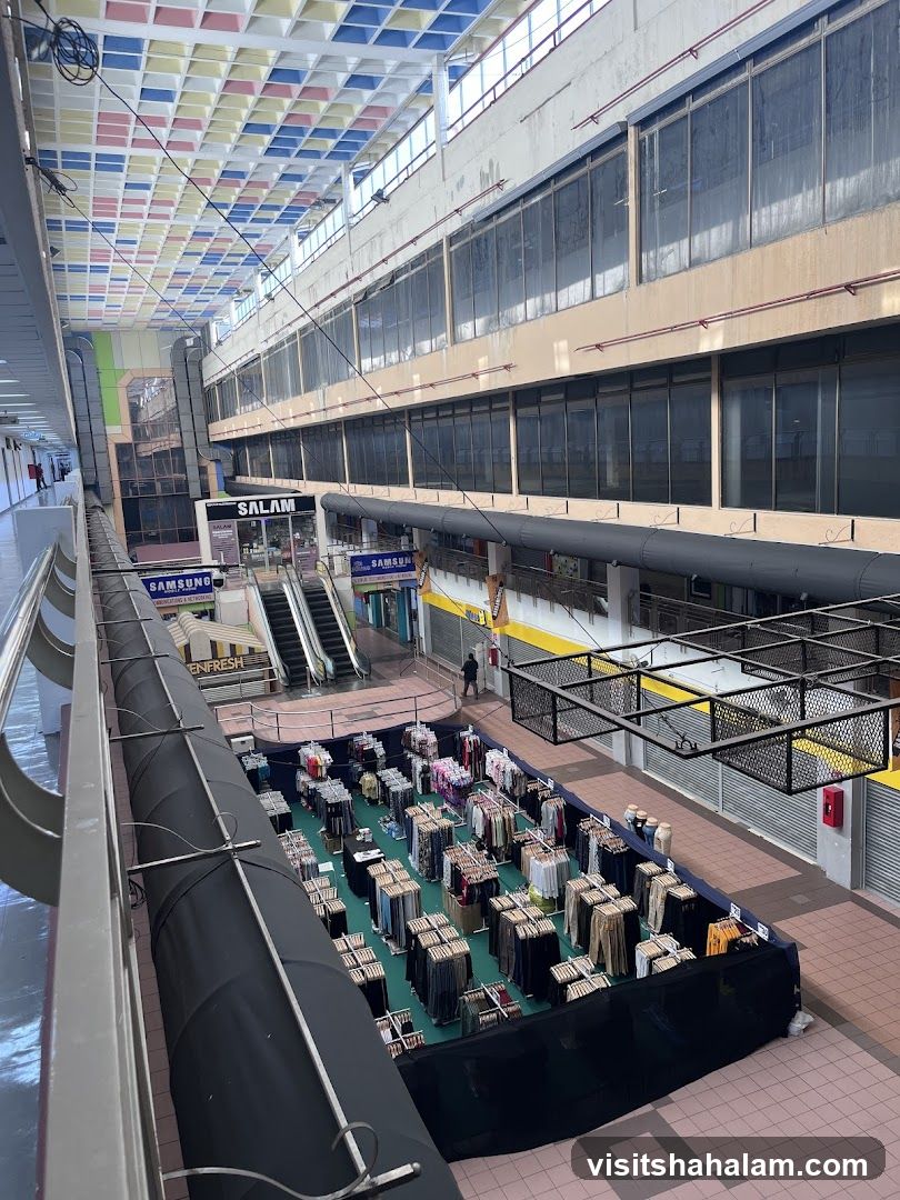 Indoor market with clothing stalls