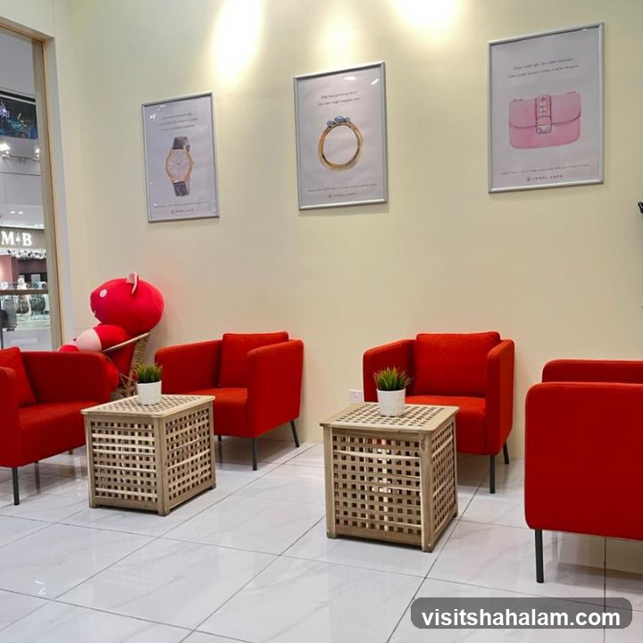 Waiting Area with Red Chairs and Artwork