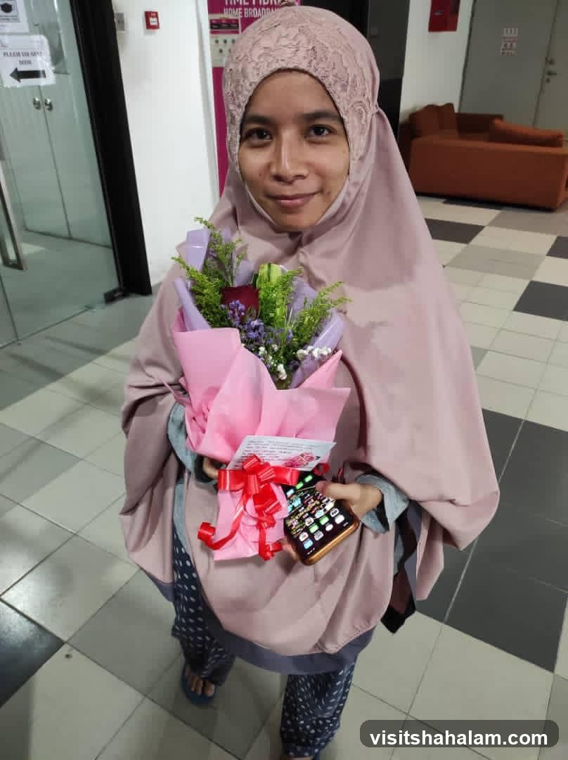 Woman holding a bouquet and a phone
