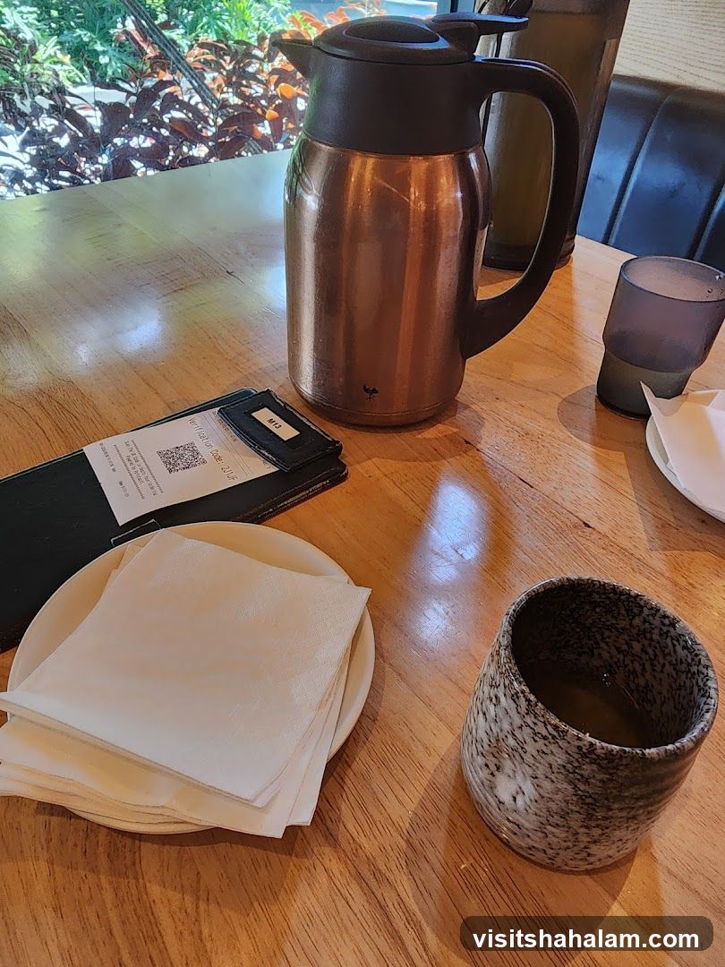 Table Setting with Thermos and Tea Cup