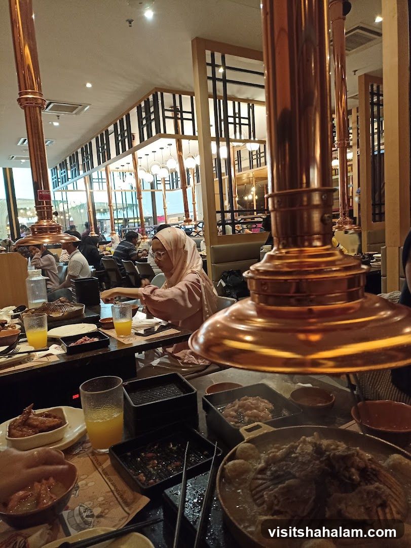Diners at a restaurant with copper ventilation hoods