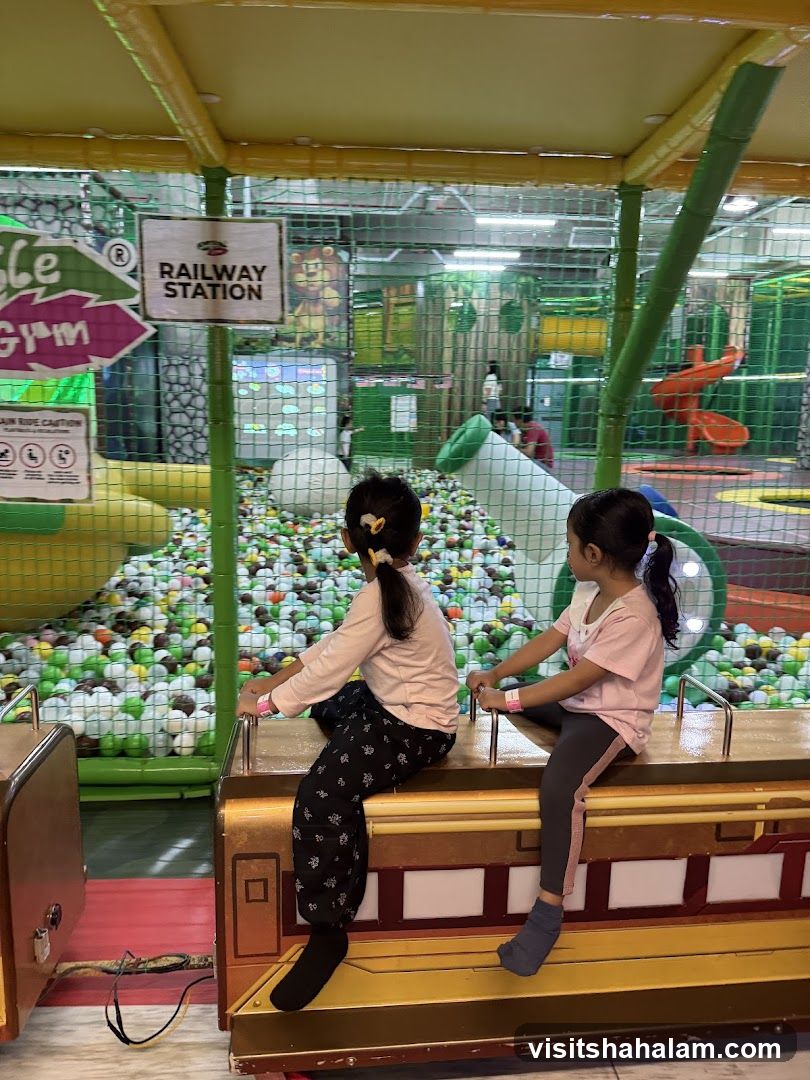 Children on a train ride at a play center