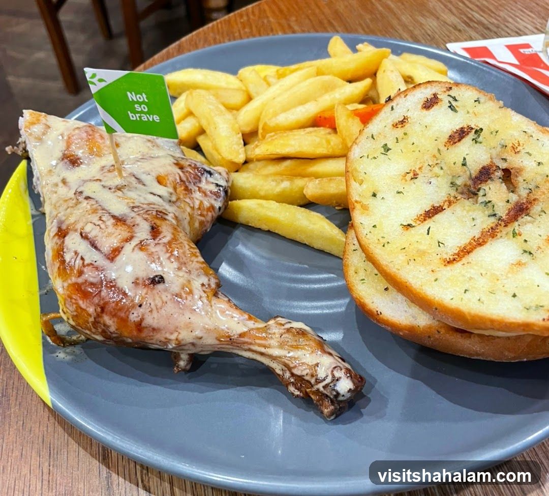 Chicken meal with fries and garlic bread