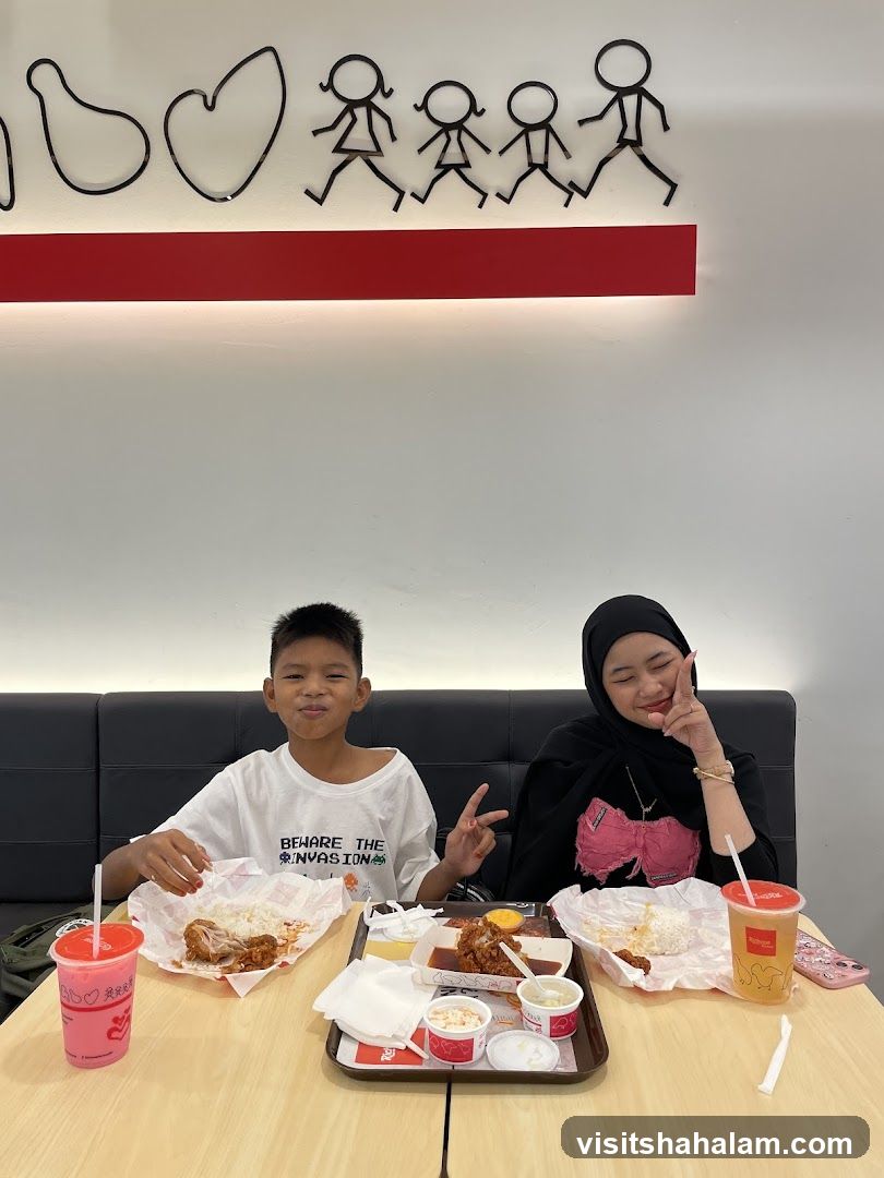Two people eating fried chicken