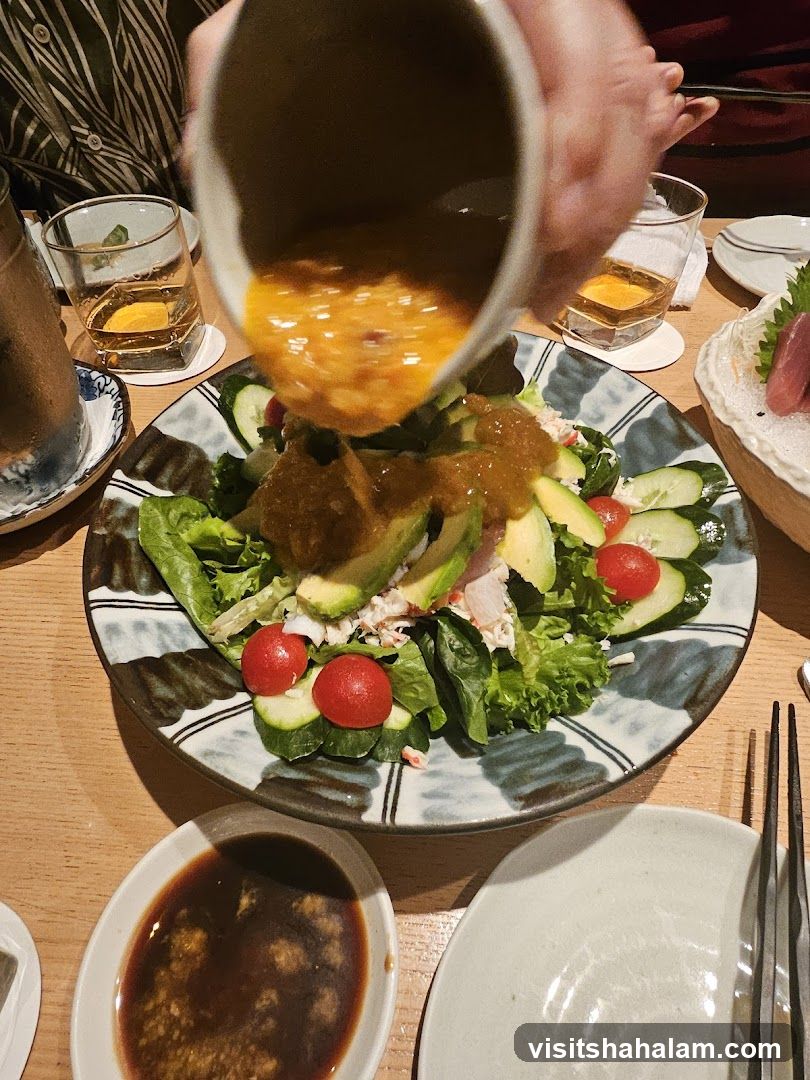 Salad being dressed