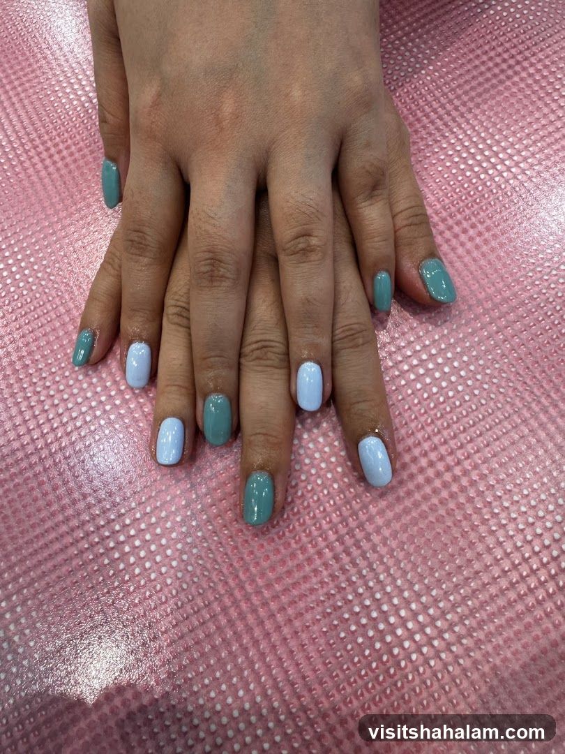 Manicured Hands with Blue and Teal Polish
